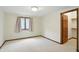 Cozy bedroom with a window, neutral carpeting, and a closet, providing a comfortable retreat at 1326 Pebble Brook Dr, Noblesville, IN 46062