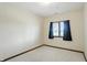 Cozy bedroom with carpet, window, black curtains and a view to the outside at 1326 Pebble Brook Dr, Noblesville, IN 46062