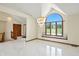 Sun-filled entryway with marble floors, a chandelier, and a large window at 1326 Pebble Brook Dr, Noblesville, IN 46062