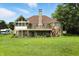Expansive home featuring a deck, screened porch, and a large, well-maintained lawn at 1326 Pebble Brook Dr, Noblesville, IN 46062