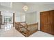 Bright foyer featuring marble floors, a stylish chandelier, and a wooden staircase with access to the living areas at 1326 Pebble Brook Dr, Noblesville, IN 46062