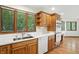 Kitchen boasts wood cabinets, stainless appliances, and views of the yard from the kitchen sink at 1326 Pebble Brook Dr, Noblesville, IN 46062