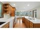 Kitchen offers wood cabinets, stainless appliances, and large island with cooktop and breakfast bar seating at 1326 Pebble Brook Dr, Noblesville, IN 46062