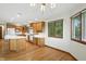 Bright kitchen featuring an island, natural wood cabinetry, and stainless steel appliances at 1326 Pebble Brook Dr, Noblesville, IN 46062
