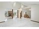 Spacious living room showcasing a brick fireplace, marble floors, and high ceilings at 1326 Pebble Brook Dr, Noblesville, IN 46062