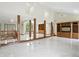Open living area with a staircase, built-in shelving, and marble floors at 1326 Pebble Brook Dr, Noblesville, IN 46062