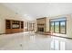Open living area featuring a fireplace, built-in shelving, and views of the backyard at 1326 Pebble Brook Dr, Noblesville, IN 46062
