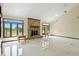 Bright living room with a brick fireplace, large windows, and marble floors at 1326 Pebble Brook Dr, Noblesville, IN 46062