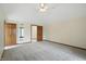 Large bedroom with neutral carpet and multiple doors at 1326 Pebble Brook Dr, Noblesville, IN 46062