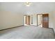 Large bedroom with neutral carpet and many doorways at 1326 Pebble Brook Dr, Noblesville, IN 46062