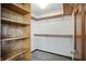 Walk-in closet boasts custom shelving and rod system for ample storage at 1326 Pebble Brook Dr, Noblesville, IN 46062