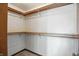 Large walk-in closet features custom shelving and rod system for storage at 1326 Pebble Brook Dr, Noblesville, IN 46062