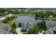 Beautiful aerial view of a blue home near a lake and other homes in a charming neighborhood at 13895 Cloverfield Cir, Fishers, IN 46038