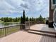 Spacious back deck overlooking a serene pond, perfect for outdoor entertaining at 13895 Cloverfield Cir, Fishers, IN 46038
