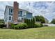 Rear view of the house featuring a large, well-maintained lawn and an outdoor deck at 13895 Cloverfield Cir, Fishers, IN 46038
