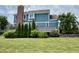 Manicured backyard with a deck, mature trees, and a well-maintained lawn at 13895 Cloverfield Cir, Fishers, IN 46038