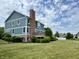 Lush backyard offering ample space with well-kept landscaping, deck and mature trees at 13895 Cloverfield Cir, Fishers, IN 46038