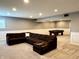 Well-lit basement features neutral carpeting, chair railing, sectional sofa, and pool table at 13895 Cloverfield Cir, Fishers, IN 46038