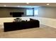 Finished basement with sectional couch and wall-mounted TV at 13895 Cloverfield Cir, Fishers, IN 46038