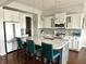 Stylish kitchen with white cabinets, granite countertops, and a center island with seating at 13895 Cloverfield Cir, Fishers, IN 46038