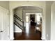Inviting home with an open floor plan, neutral walls, hardwood floors, and a visible living room at 13895 Cloverfield Cir, Fishers, IN 46038