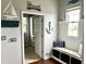 Mudroom with coastal decor, a bench with storage, and access to other rooms at 13895 Cloverfield Cir, Fishers, IN 46038