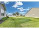 Expansive lawn in the backyard with a privacy fence offers a great space for outdoor living and recreation at 1396 Lexington Trl, Greenfield, IN 46140