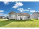 This charming home has a large manicured backyard and stylish, neutral siding at 1396 Lexington Trl, Greenfield, IN 46140