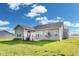 Beautifully landscaped backyard with green grass and a privacy fence at 1396 Lexington Trl, Greenfield, IN 46140