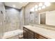 Modern bathroom with tiled walk-in shower, granite vanity and dark wood cabinets at 1396 Lexington Trl, Greenfield, IN 46140