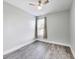 Bedroom with gray floors, a ceiling fan, and natural light from the window at 1396 Lexington Trl, Greenfield, IN 46140