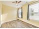 This bedroom features hardwood floors, natural light, and a ceiling fan at 1396 Lexington Trl, Greenfield, IN 46140
