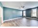 Bedroom featuring gray floors, a ceiling fan, and natural light from the windows at 1396 Lexington Trl, Greenfield, IN 46140