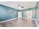 Large bedroom featuring gray floors, ensuite bathroom and walk in closet at 1396 Lexington Trl, Greenfield, IN 46140