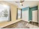 The bedroom has two windows, hardwood floors, and closet storage space at 1396 Lexington Trl, Greenfield, IN 46140