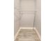 Walk-in closet with wire shelving and modern vinyl floors at 1396 Lexington Trl, Greenfield, IN 46140