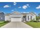 Charming home with a neatly manicured lawn and a two-car garage, offering great curb appeal at 1396 Lexington Trl, Greenfield, IN 46140
