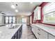 Granite countertops and an open layout make this kitchen ideal for cooking and entertaining at 1396 Lexington Trl, Greenfield, IN 46140