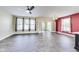 Spacious living room with modern flooring, a ceiling fan, and french doors at 1396 Lexington Trl, Greenfield, IN 46140