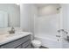 Bathroom featuring a gray vanity with white countertop and a combined shower and tub at 14521 Hanford Ln, Carmel, IN 46074