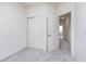 Bedroom featuring a sliding door closet, an open doorway, and light-colored carpet at 14521 Hanford Ln, Carmel, IN 46074
