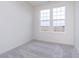 Bedroom with two large windows providing natural light and neutral-colored carpet at 14521 Hanford Ln, Carmel, IN 46074