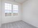 Bedroom with two large windows providing natural light and neutral-colored carpet at 14521 Hanford Ln, Carmel, IN 46074