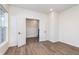 Bright bedroom features wood-look flooring, a window, and an open doorway to the upper level at 14521 Hanford Ln, Carmel, IN 46074