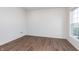 Minimalist bedroom featuring hardwood floors, neutral walls, natural light, and a serene atmosphere at 14521 Hanford Ln, Carmel, IN 46074