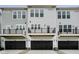 Modern townhome featuring a two-car garage and second floor balcony at 14521 Hanford Ln, Carmel, IN 46074