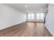 Bright and airy living room with recessed lighting and hardwood floors, flooded with natural light from large windows at 14521 Hanford Ln, Carmel, IN 46074