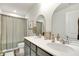 Bathroom featuring a dual-sink vanity, neutral colors, and a framed mirror at 15192 Montfort Dr, Noblesville, IN 46062