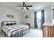 Bedroom with a plaid bed, dark curtains, and a dark ceiling fan at 15192 Montfort Dr, Noblesville, IN 46062