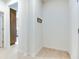Clean hallway with access to kitchen and coat hooks on the wall at 15192 Montfort Dr, Noblesville, IN 46062